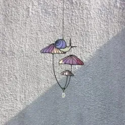 Mushrooms with Snail Stained Glass Window Hangings. Pink Suncatcher Mushrooms for Home Decoration. Perfect Gift for Friends or Coworkers. Mushrooms with Snail Stained Glass Window Hangings. Pink Suncatcher Mushrooms for Home Decoration. Perfect Gift for Friends or Coworkers.